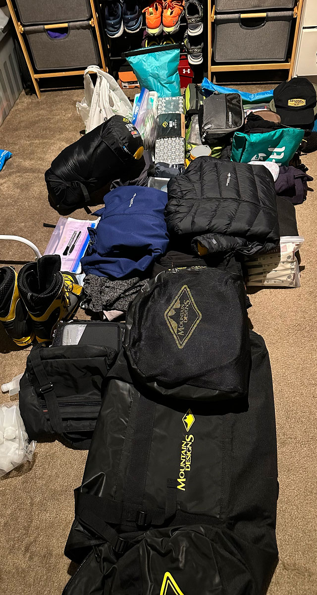 Mountain Designs backpack, innerwear, puffer jacket, sleeping bag and equipment