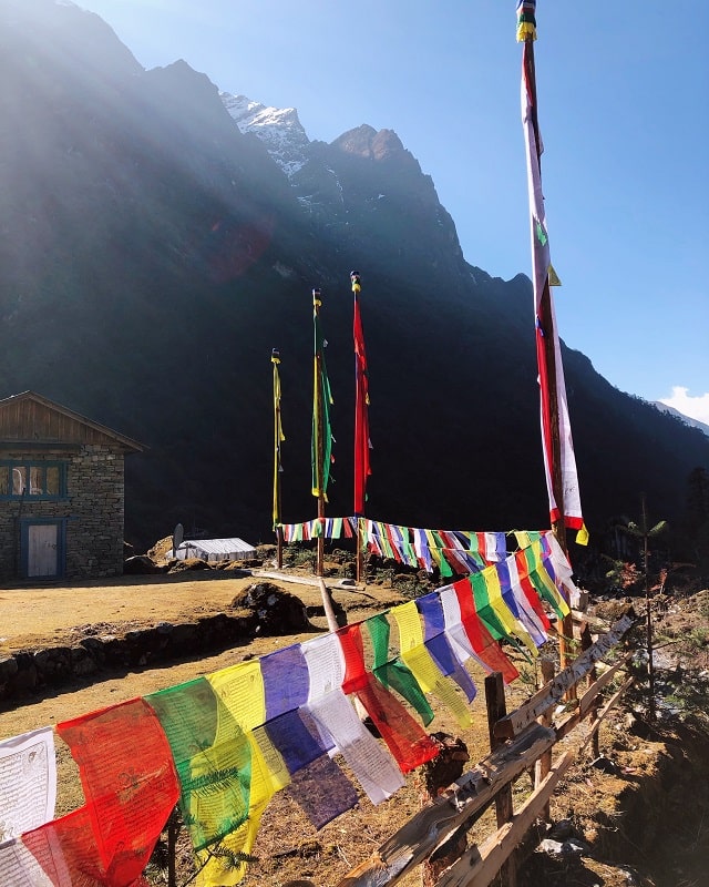 Another angle of the colourful prayer flags in Kothe