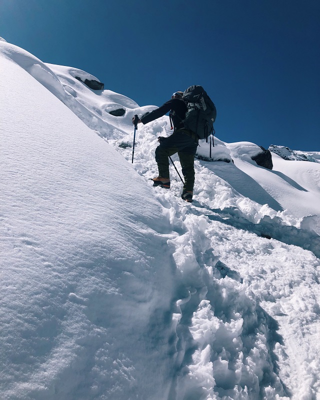 Pemba Sherpa climbing an incline on snow terrain