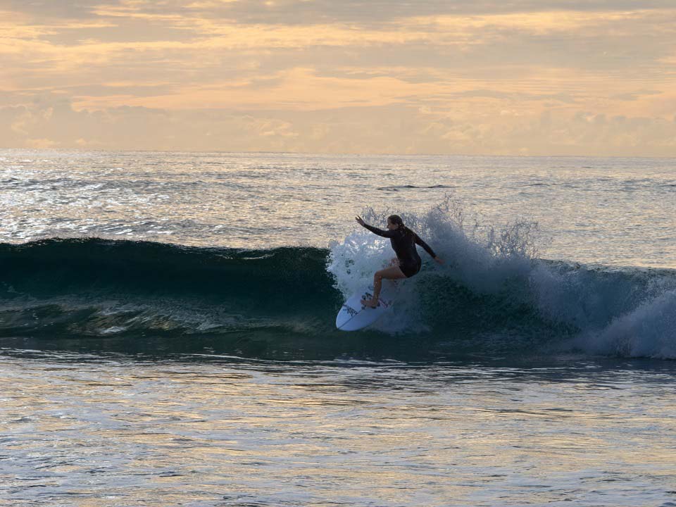 Surfer India Robinson catching some waves Surfer India Robinson catching some waves
