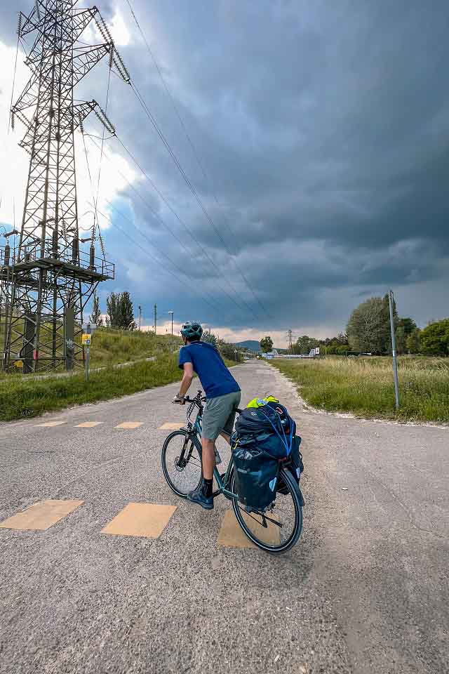 Zach pausing on a road to examine the incoming storm clouds Zach pausing on a road to examine the incoming storm clouds