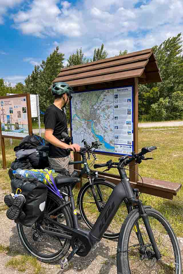 Zach checking a Slovak map and sign stop Zach checking a Slovak map and sign stop