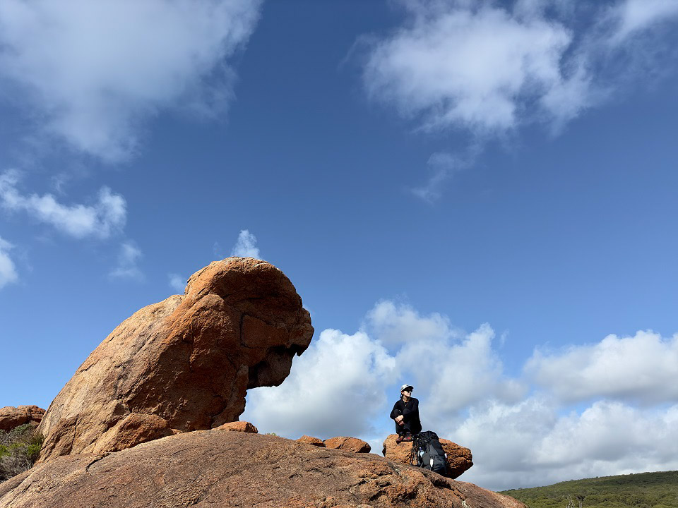 Julia D’Orazio resting at a shaded rock formation