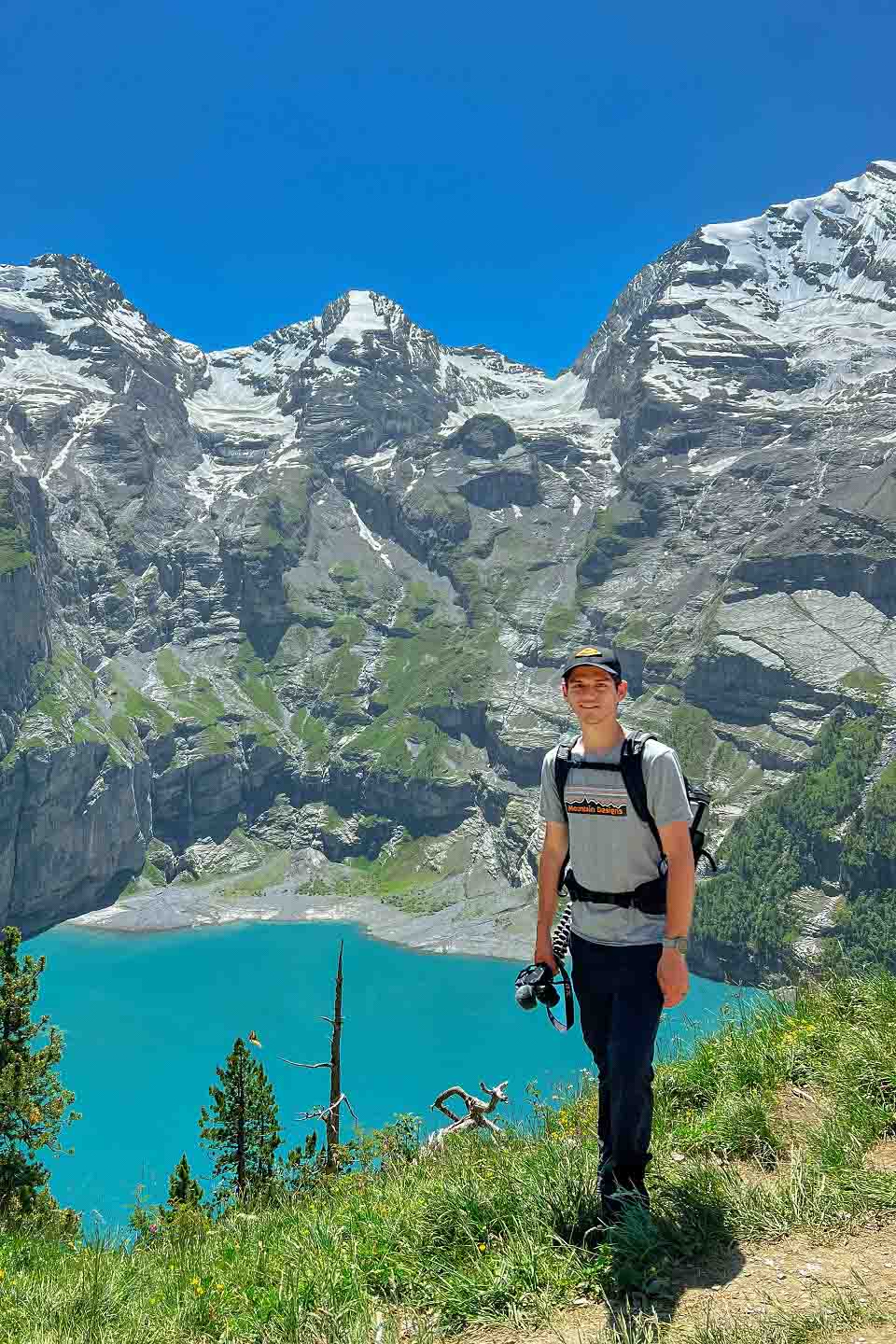 Zach posing with the mountains and Lake Oeschinen below Zach posing with the mountains and Lake Oeschinen below