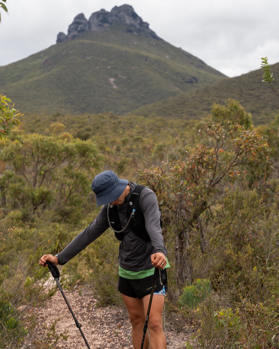 Jake pausing for breath on a hiking trial with a mountain view Jake pausing for breath on a hiking trial with a mountain view