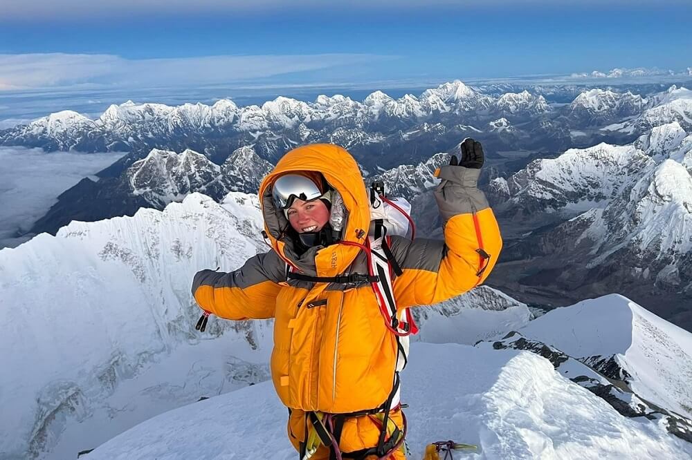 Gabby Kanizay stands on top of Mt Everest