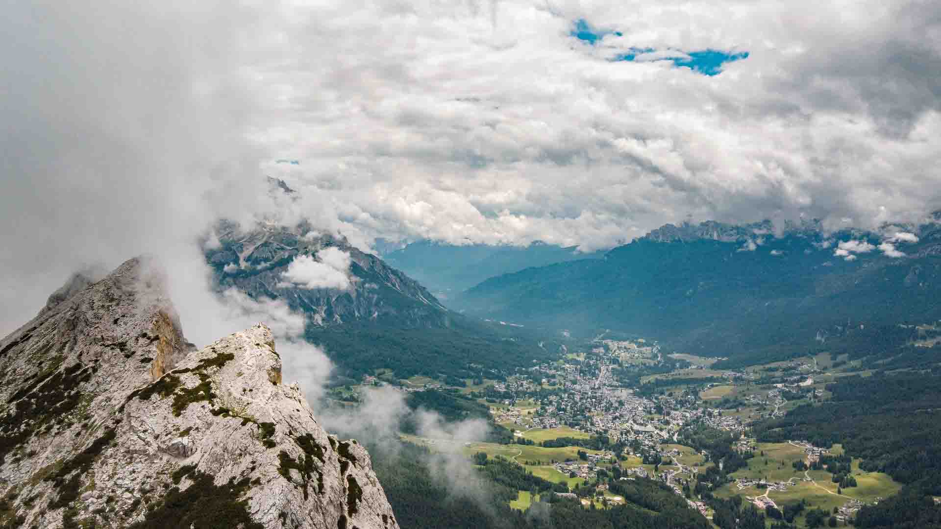 Arial shot of the summit and view of Cortina De’Ampezo below Arial shot of the summit and view of Cortina De’Ampezo below