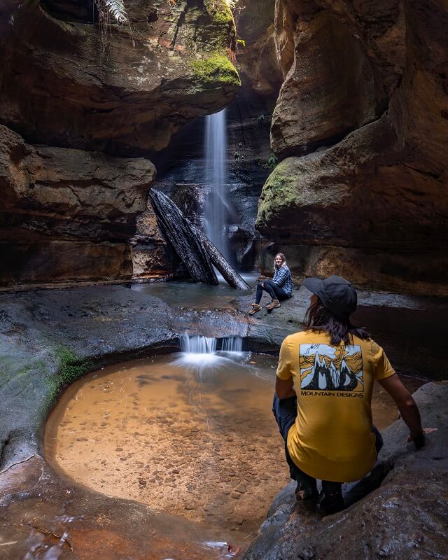 Cascading falls against a red sandstone backdrop capture the imagination