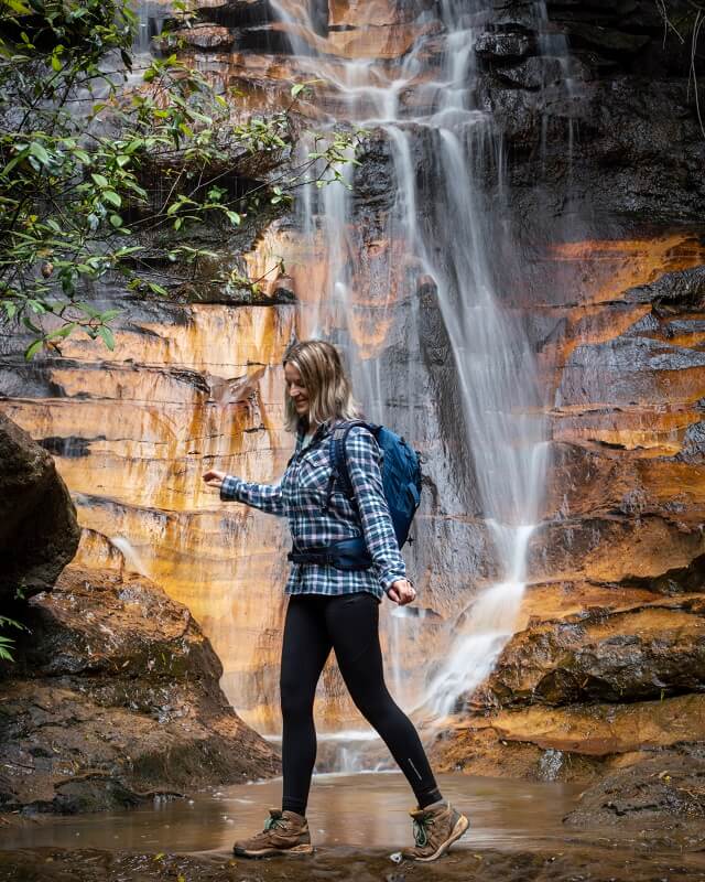 Cascading falls against a red sandstone backdrop capture the imagination